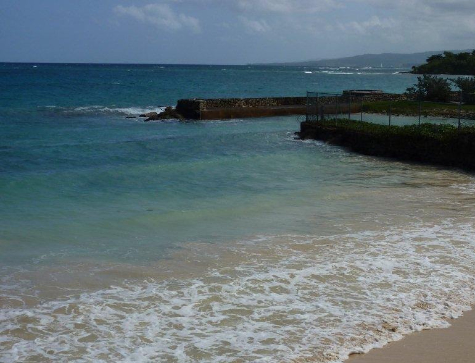 The beach at Miramar Villas, waves coming in along the shoreline